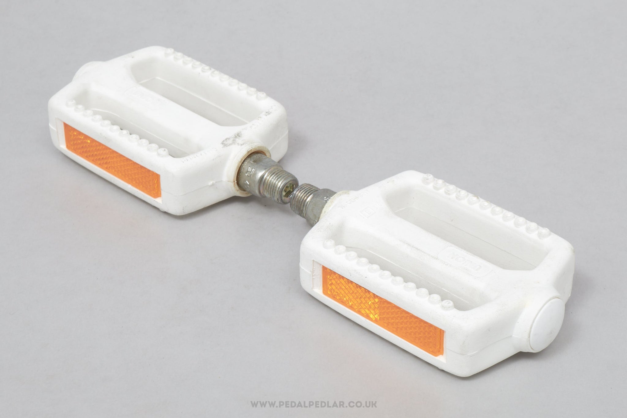 White bicycle pedals shop